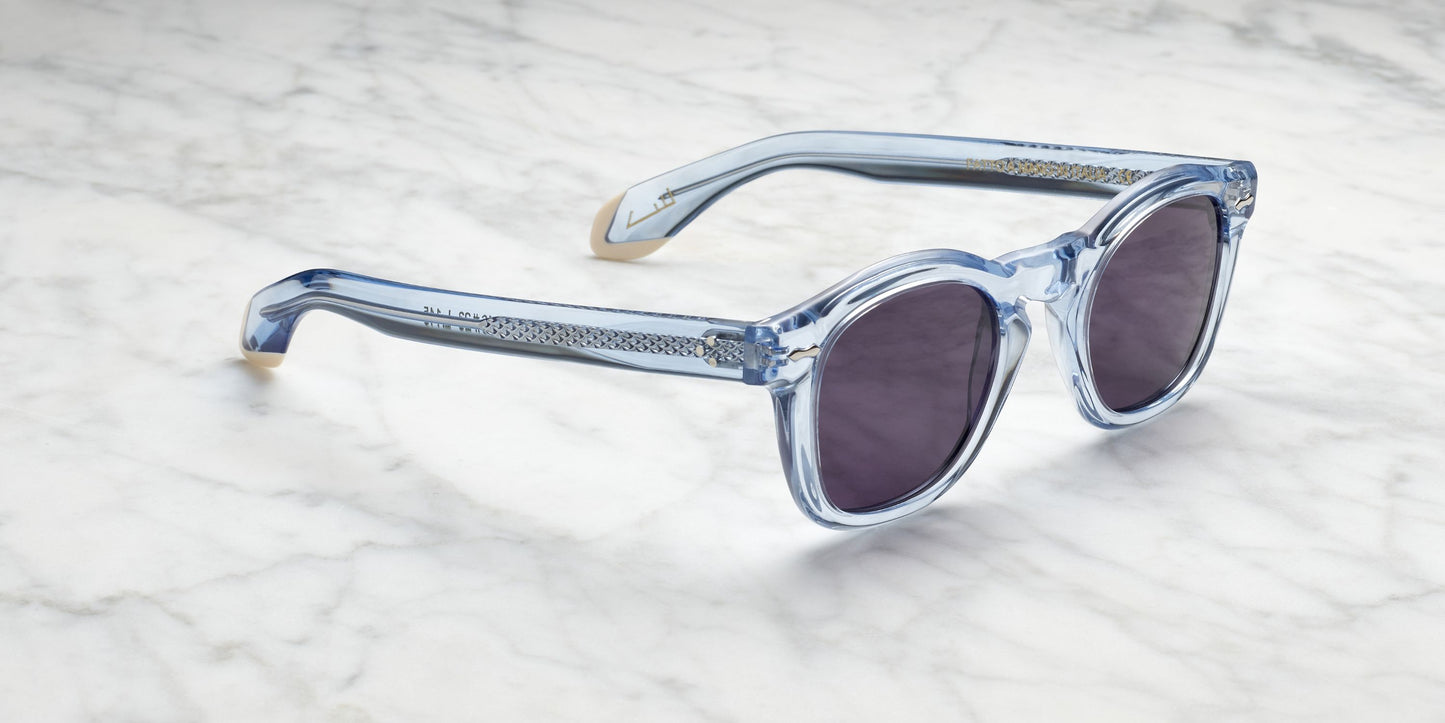 occhiali da sole in acetato trasparente azzurro con dettagli in acciaio a vista